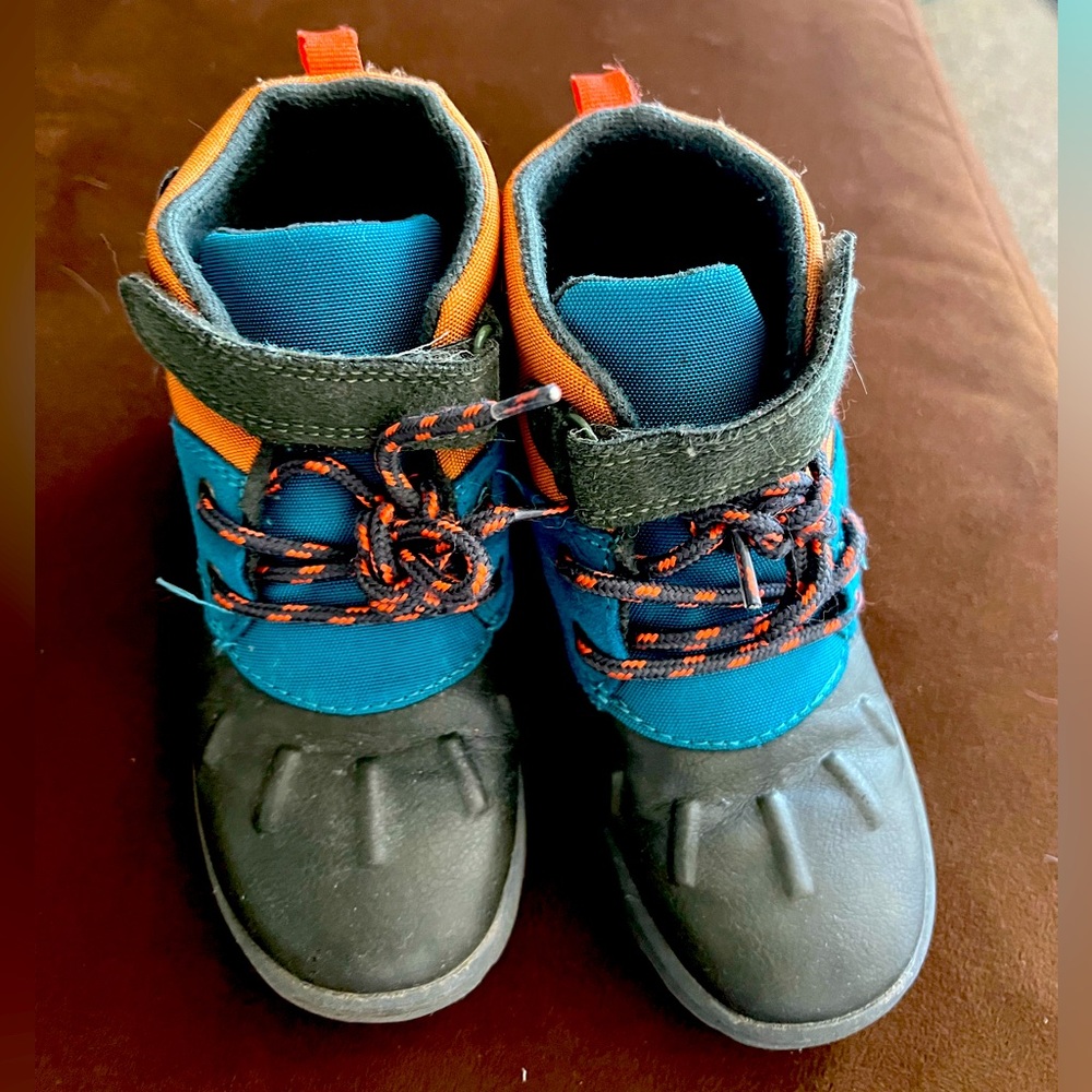 Carter’s boots for toddler size 11 color black , blue and tan .